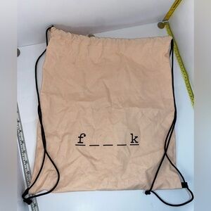 F word Peach Drawstring Backpack with Black Lettering